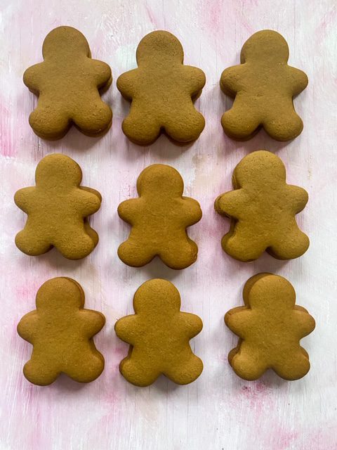 gingerbread man cookies on a white plate no frosting