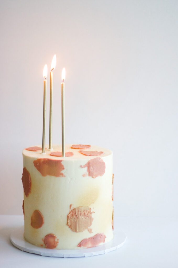 a cake with candles lit