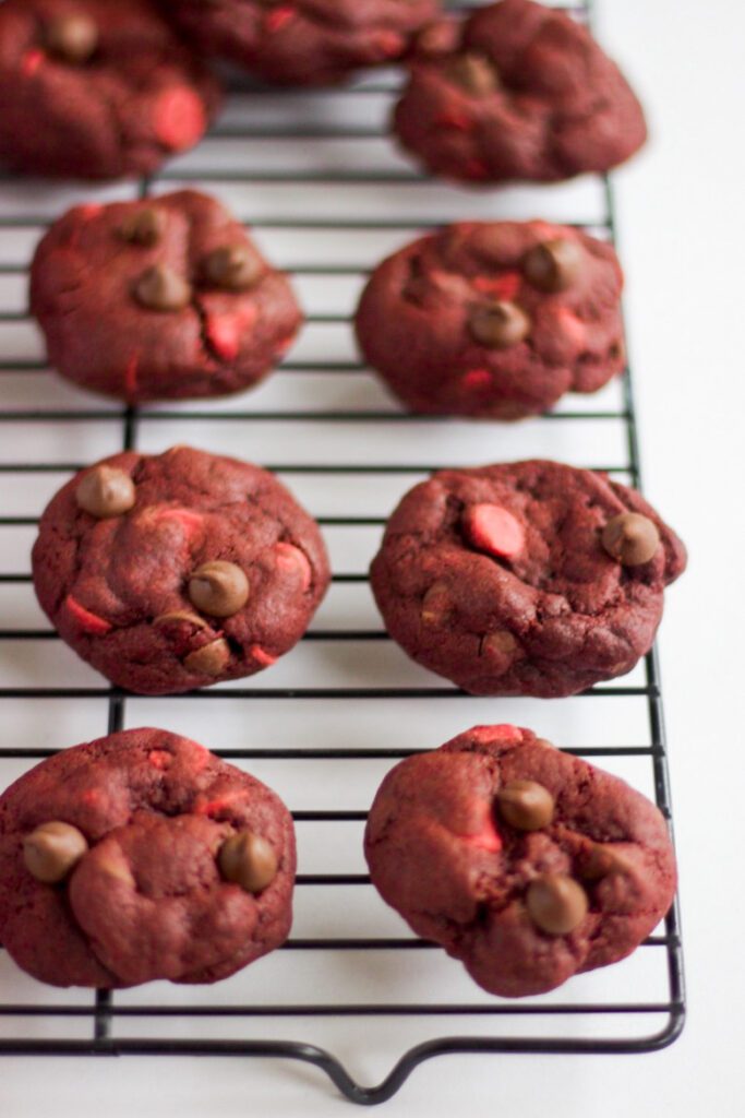 red velvet cookies sitting on cooling tray