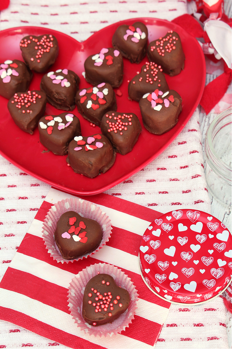 Valentine's Day Oreo truffles on a heart plate.