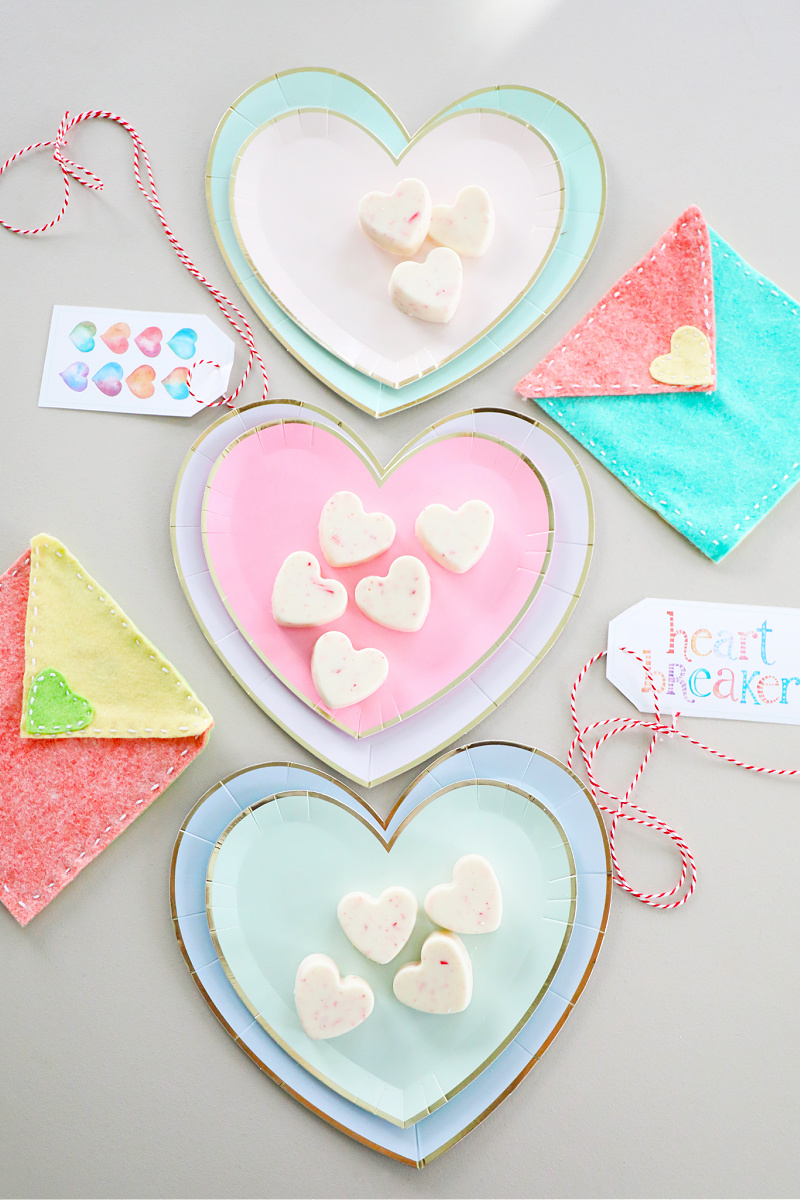 White chocolate peppermint hearts on heart plates with pretty watercolor Valentine's Day tags.