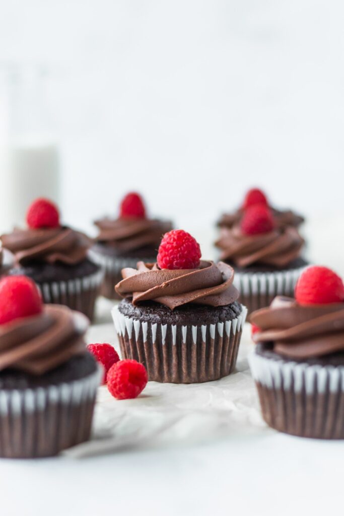 chocolate cupcakes with raspberry on top