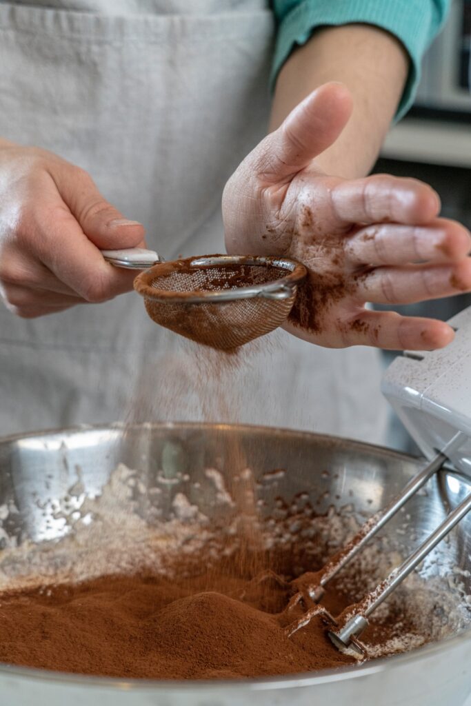 cocoa powder being sifted