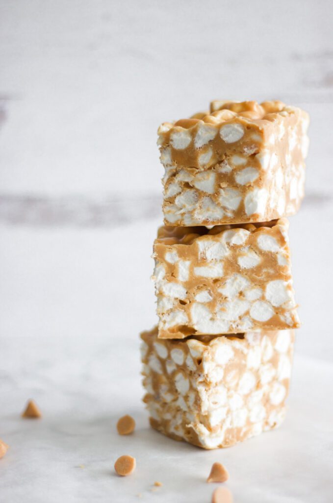 stacked butterscotch squares with butterscotch chips lying on the table