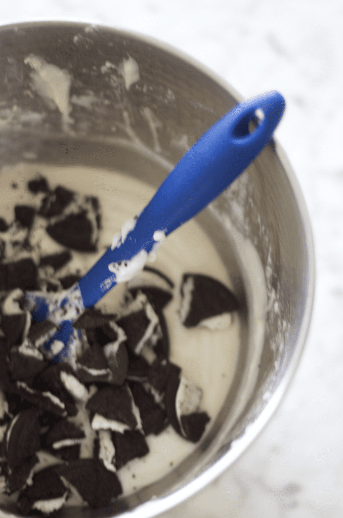 vanilla cupcake batter with crushed Oreos in it