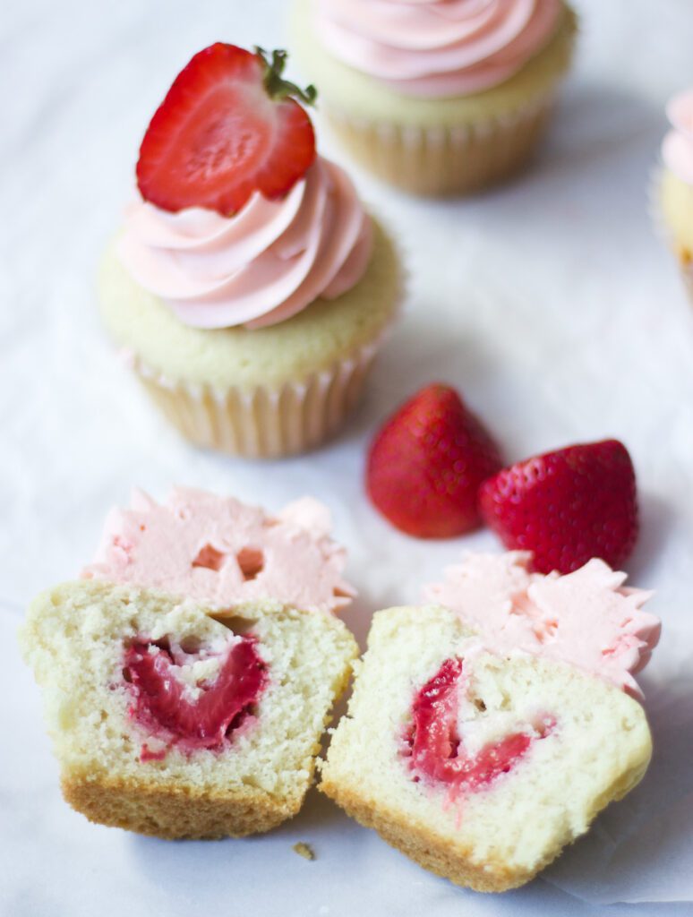 strawberry filled cupcakes cut open