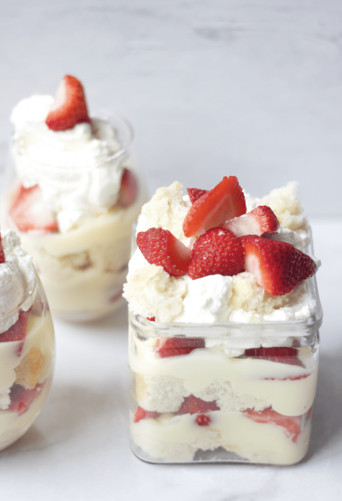 Mini strawberry shortcake trifles in little glass jars.