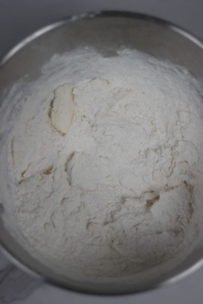 dough being mixed in mixer