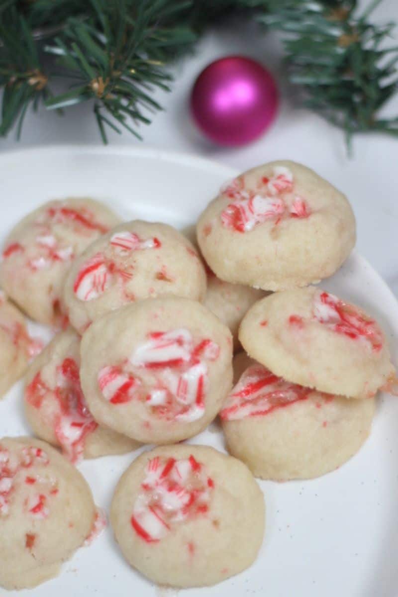 candy cane shortbread cookies stacked on a plate