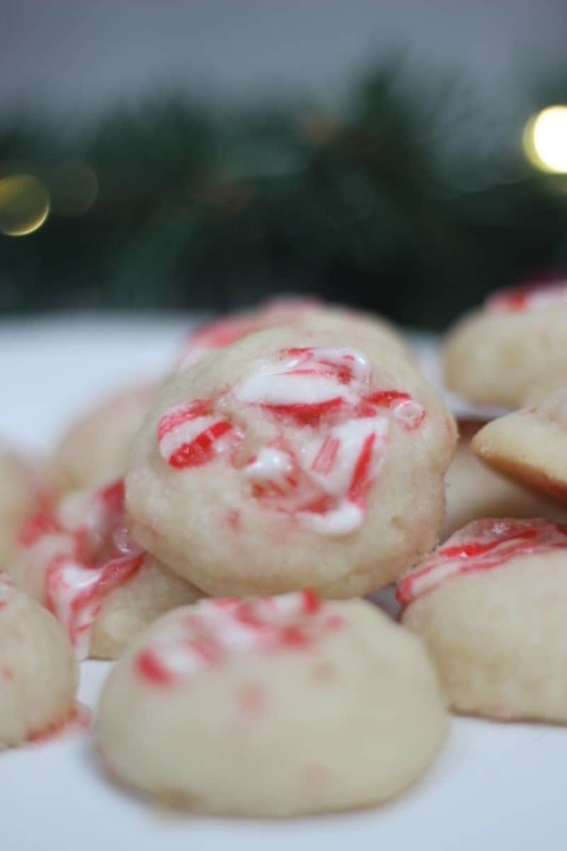 candy cane shortbread cookies stacked on a plate