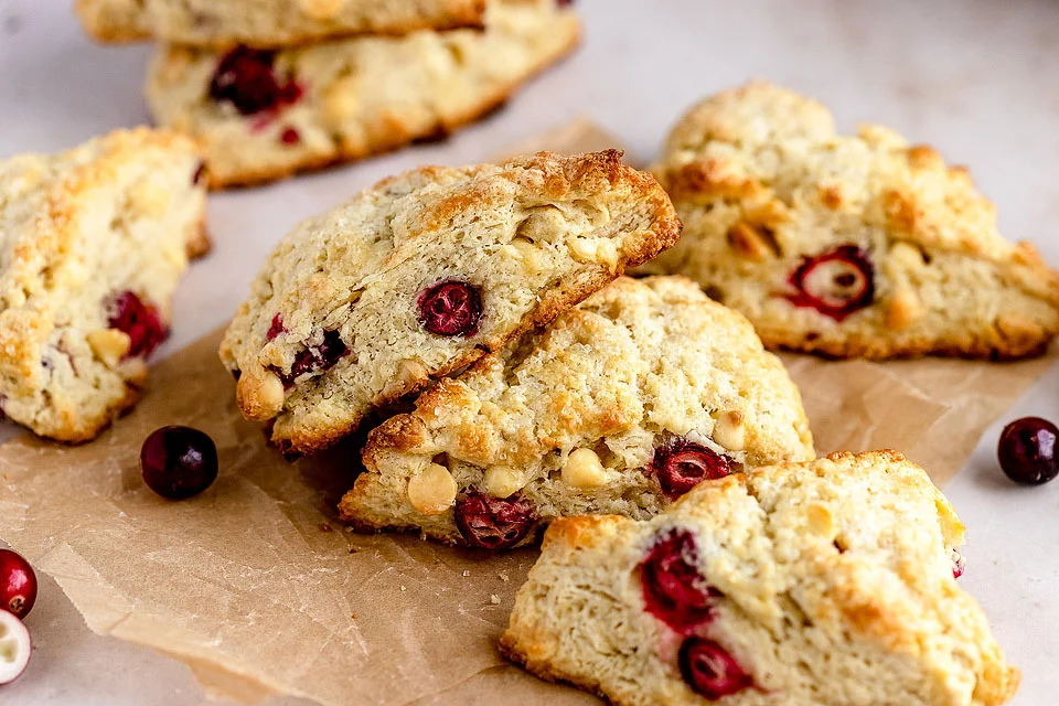 white chocolate cranberry scones on a paper