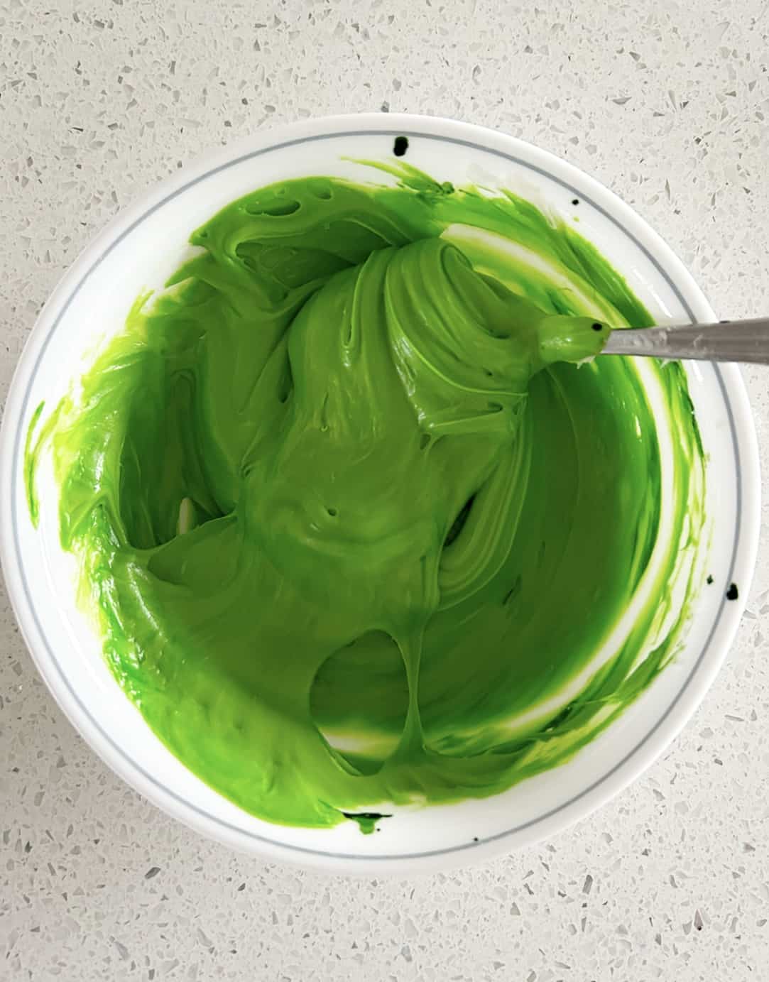 green food coloring in a bowl
