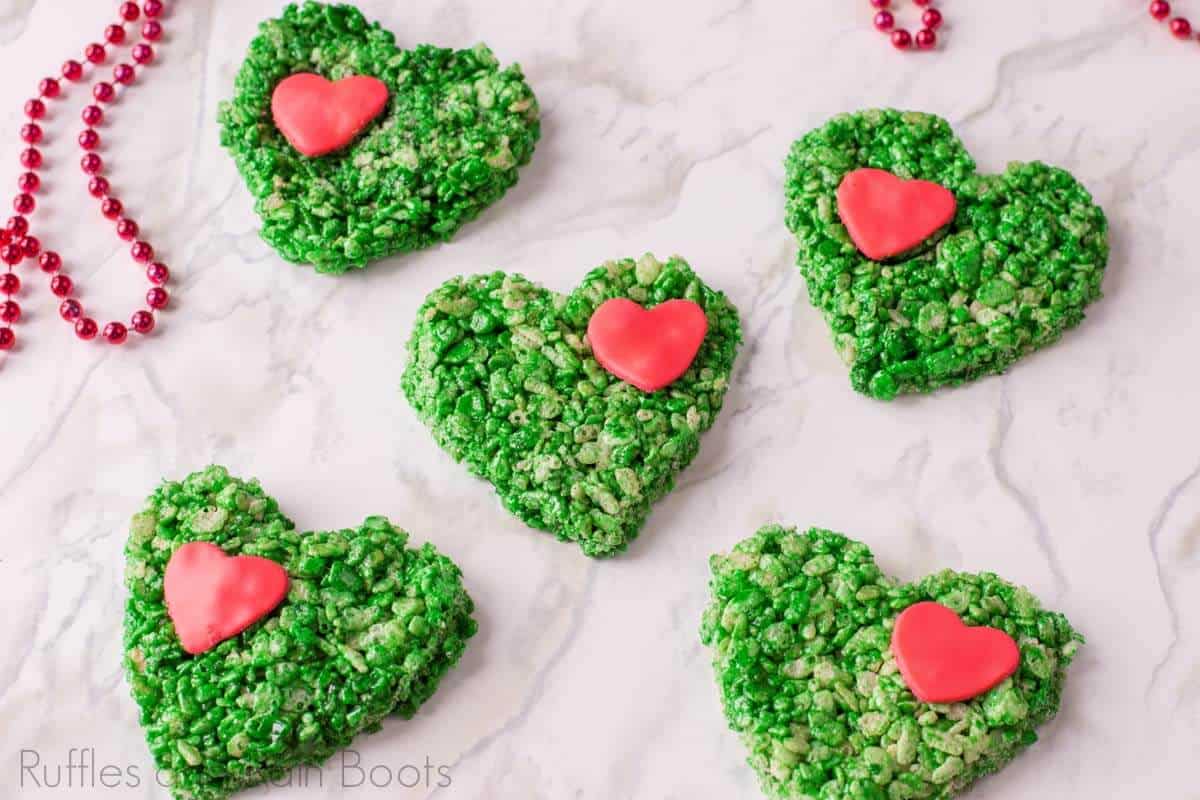 heart shaped grinch rice krispies on a plate