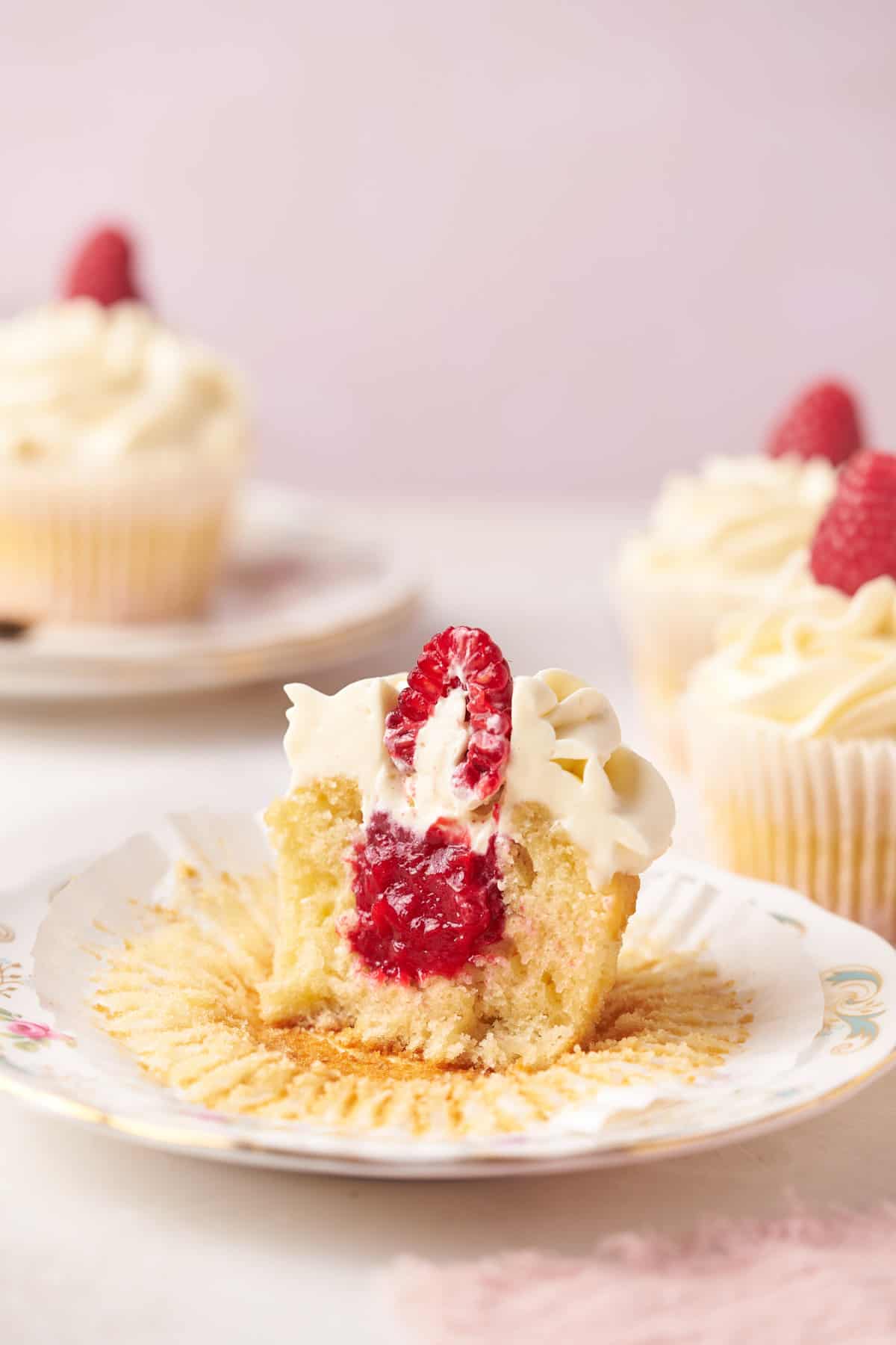 raspberry filled cupcakes on a plate