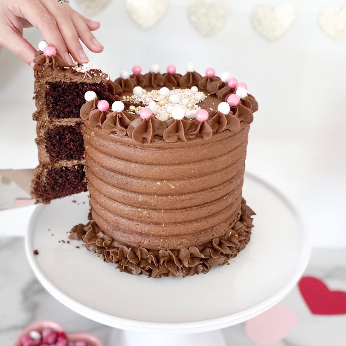 a chocolate cake being sliced