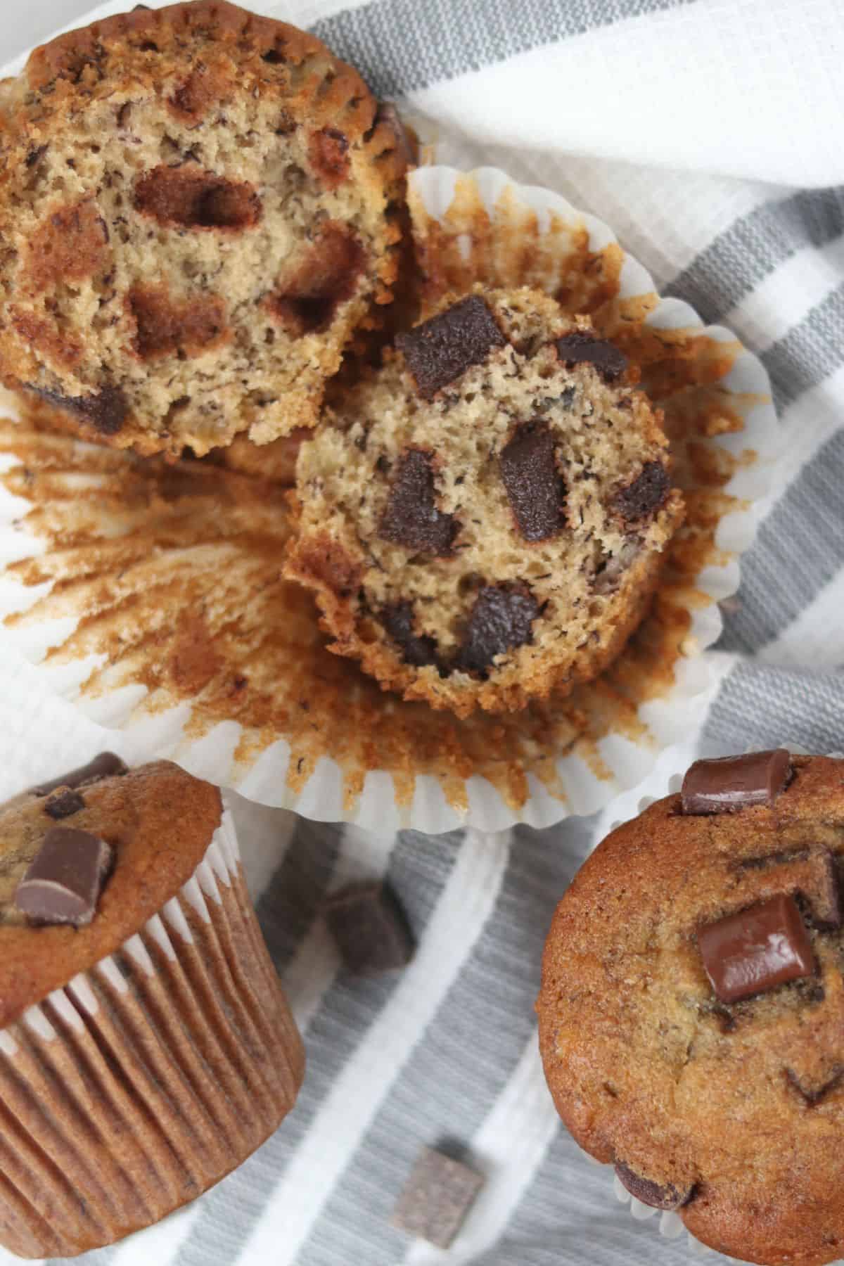 banana muffin open showing center with chocolate chips