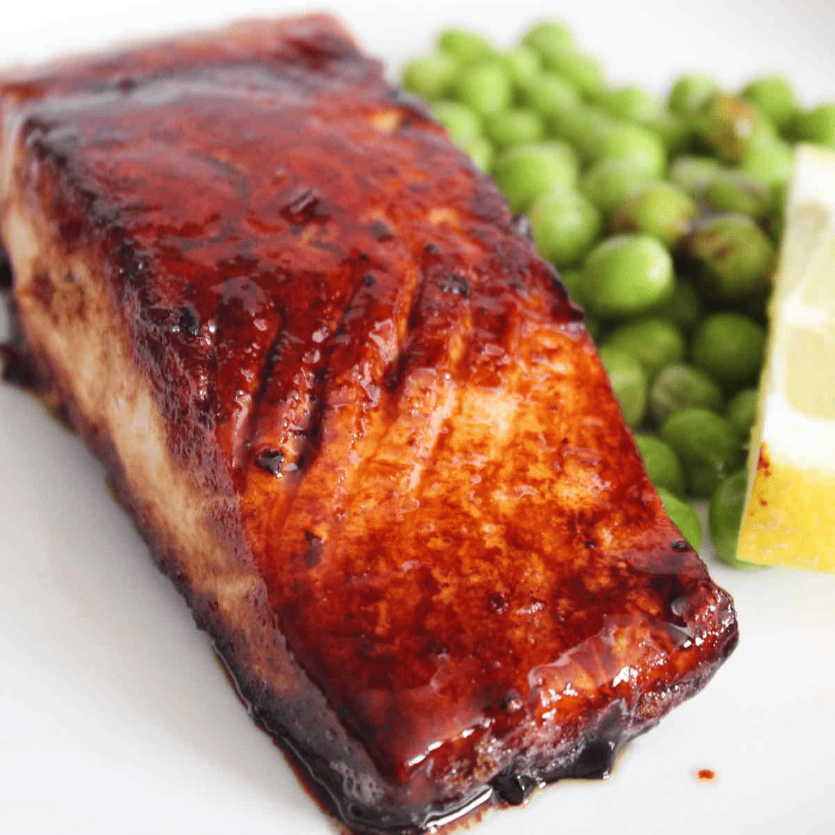 brown butter salmon on a plate with peas