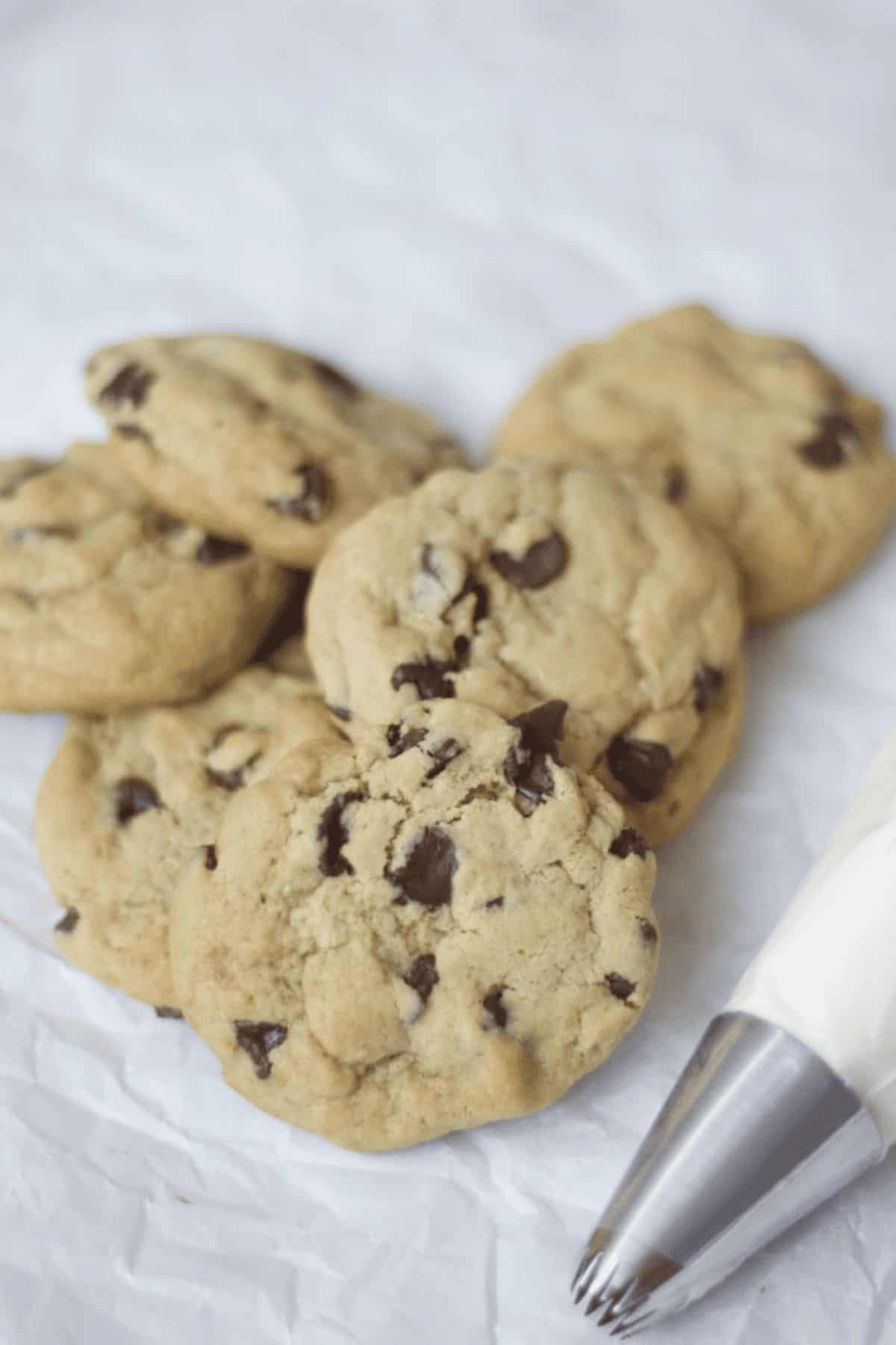 chocolate chip cookies on a piece of parchment