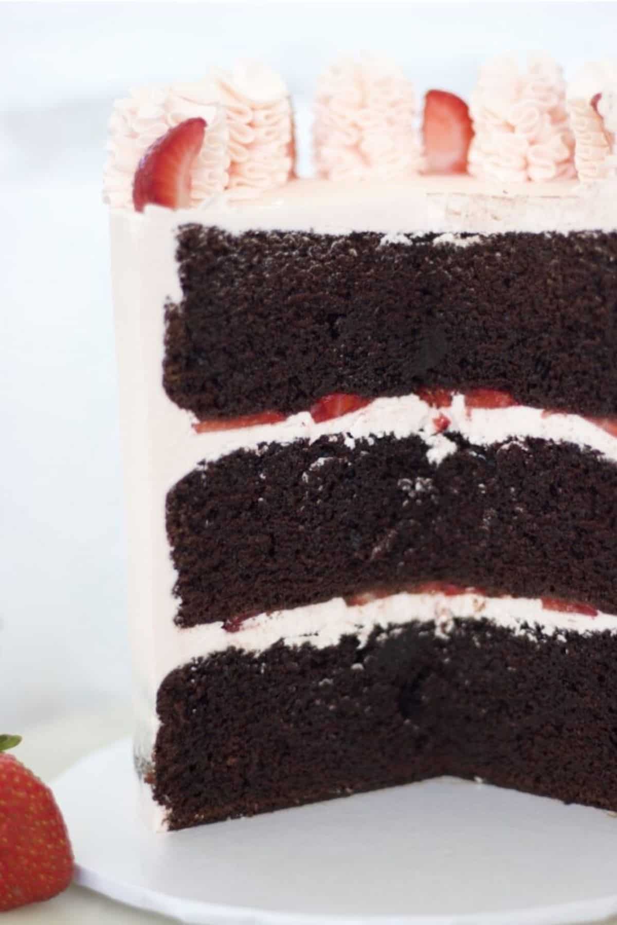 rose buttercream cake cut open to show inside of cake