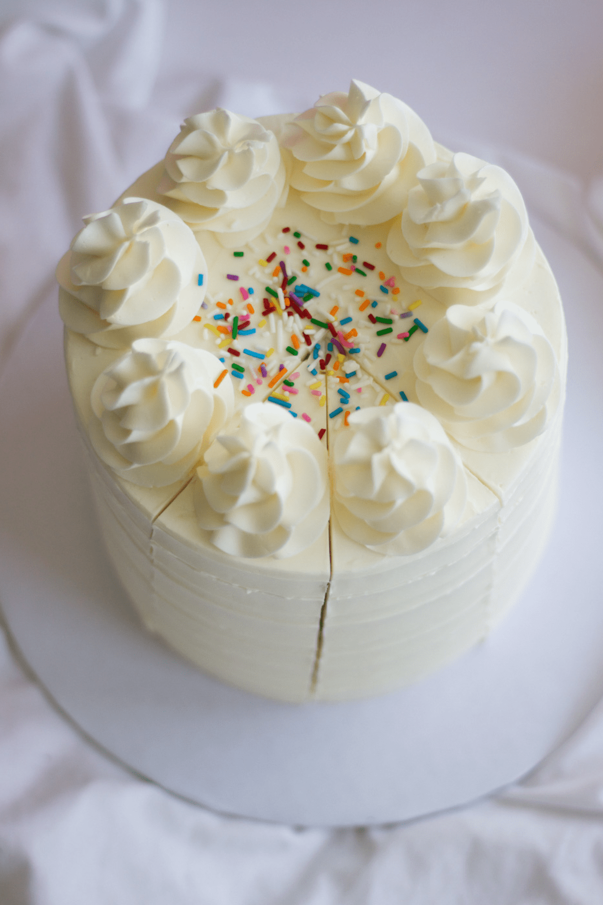 vanilla cake with two slices cut